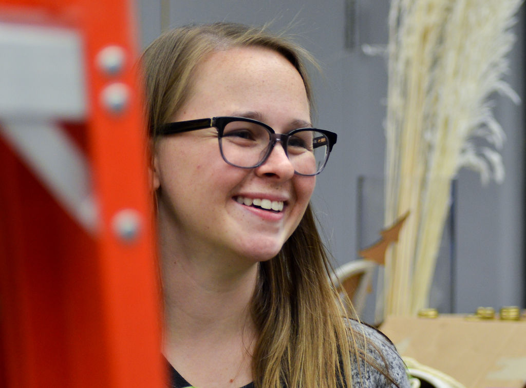 Maggie Murin works on displaying